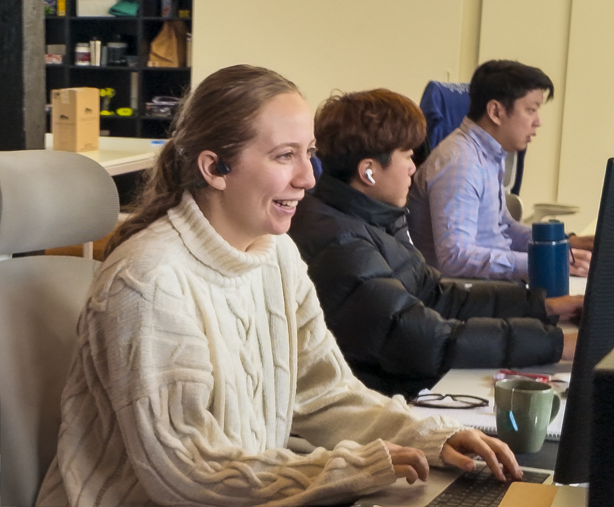 Double H Marketing team members working at computers